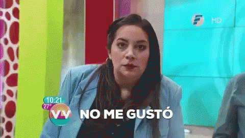 a woman in a blue jacket says " no me gusto " in spanish