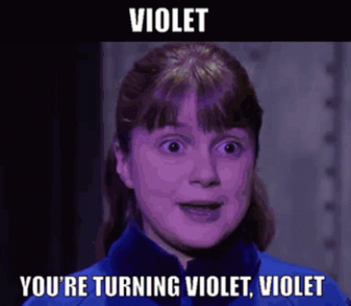A Woman In A Blue Jacket With The Words Violet You 'Re Turning Violet Violet On The Bottom GIF