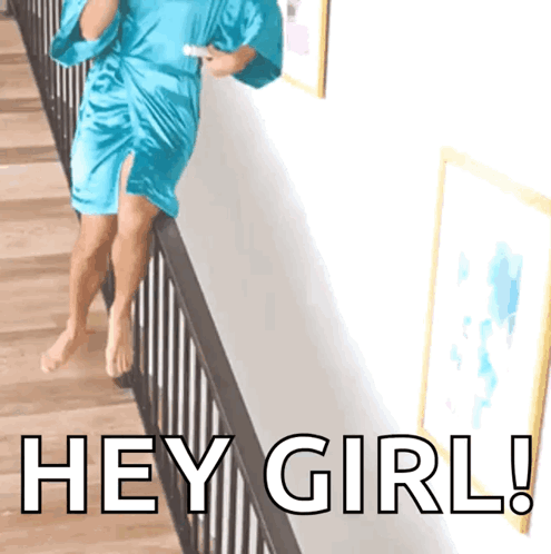 A Woman In A Blue Robe Is Standing On A Railing With The Words Hey Girl Written On The Bottom GIF