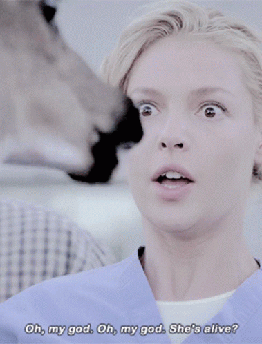 a woman in a blue scrub says oh my god