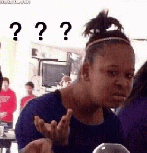 A Woman In A Blue Shirt Is Making A Funny Face With Three Question Marks . GIF