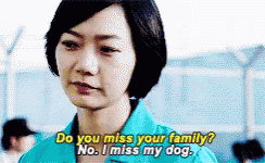 A Woman In A Blue Shirt Is Saying Do You Miss Your Family GIF