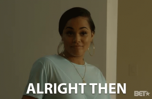 A Woman In A Blue Shirt Is Smiling And The Words Alright Then Are Behind Her GIF