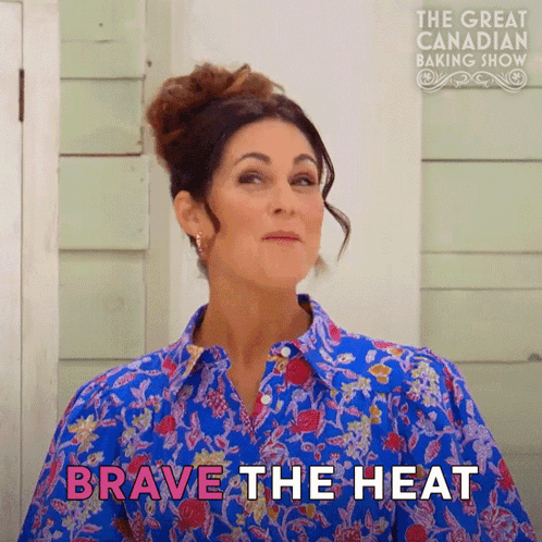 A Woman In A Blue Shirt Says " Brave The Heat " In Pink GIF