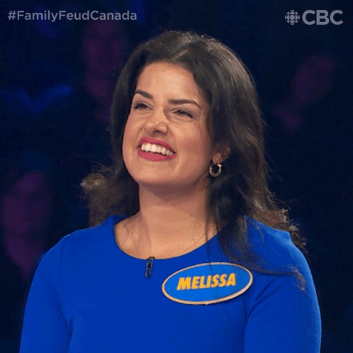 A Woman In A Blue Shirt With A Name Tag That Says Melissa GIF