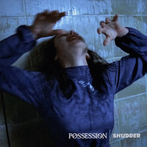 A Woman In A Blue Shirt With The Word Possession On The Bottom Right GIF