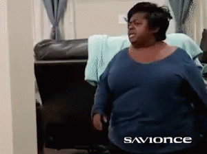 A Woman In A Blue Shirt With The Words Savonce On The Bottom GIF