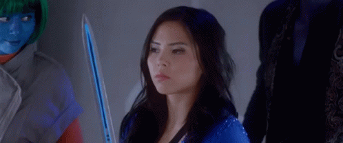 A Woman In A Blue Suit Is Sitting In Front Of A Group Of People And Says Fight . GIF