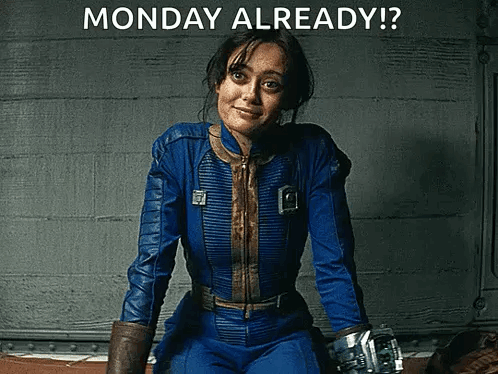A Woman In A Blue Suit Is Sitting In Front Of A Wall With The Words Monday Already Written On It . GIF