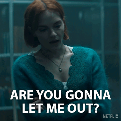 A Woman In A Blue Sweater Is Asking Are You Gonna Let Me Out ? GIF