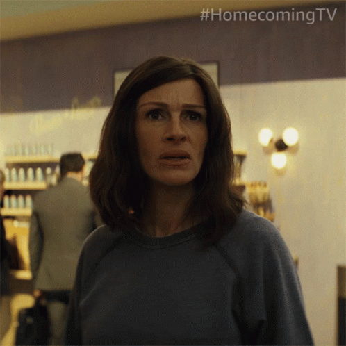 A Woman In A Blue Sweater With #Homecoming Tv On The Bottom Right GIF