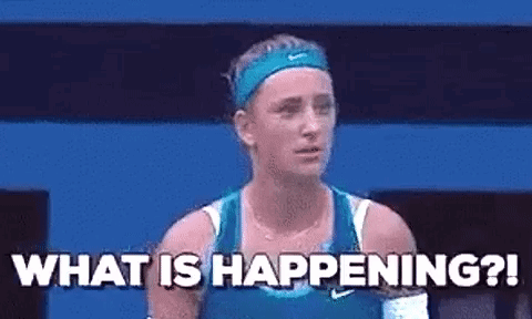 A Woman In A Blue Tank Top Is Standing On A Tennis Court And Asking What Is Happening . GIF