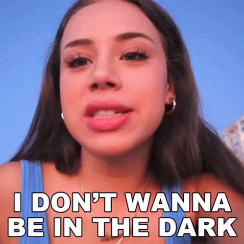 A Woman In A Blue Tank Top Says I Don 'T Wanna Be In The Dark GIF