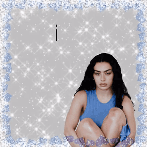 A Woman In A Blue Tank Top Sits On The Floor With The Words I Have Above Her GIF