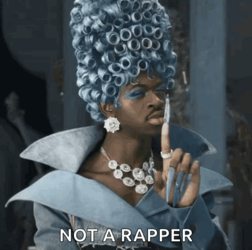 A Woman In A Blue Wig Says Not A Rapper In The Corner GIF