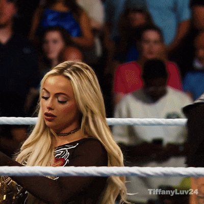A Woman In A Boxing Ring With The Hashtag Tiffanyluv24 On The Bottom GIF