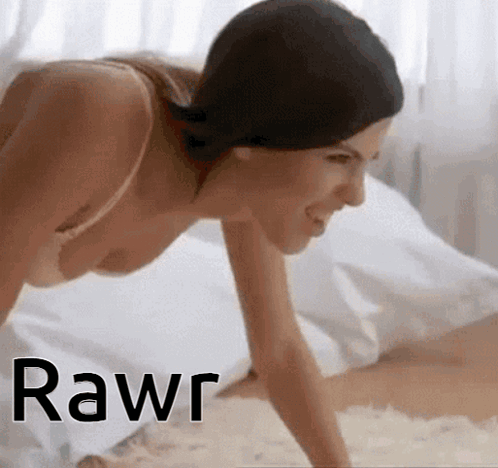 a woman in a bra is crawling on a bed with the word rawr written on the bottom