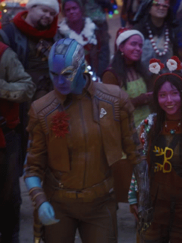 A Woman In A Brown Leather Jacket Has A Shield On Her Sleeve GIF