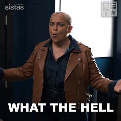 A Woman In A Brown Leather Jacket With The Words What The Hell Behind Her GIF