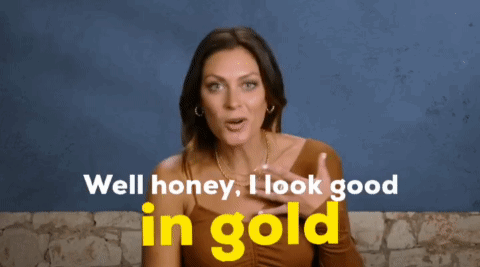 A Woman In A Brown Top Says Well Honey I Look Good In Gold GIF