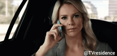 A Woman In A Car Talking On A Cell Phone GIF