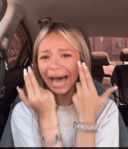 A Woman In A Car With Her Mouth Open GIF
