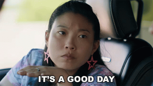 A Woman In A Car With The Words It 'S A Good Day Behind Her GIF