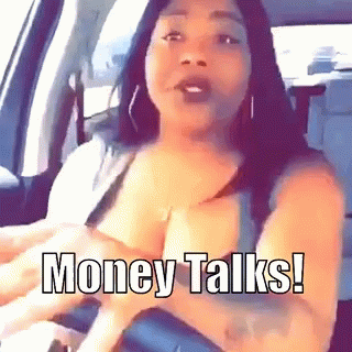 A Woman In A Car With The Words Money Talks Written On Her Chest GIF