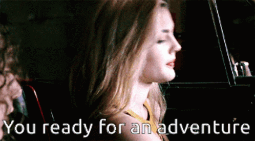 A Woman In A Car With The Words You Ready For An Adventure Written Below Her GIF