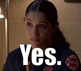 A Woman In A Chicago Fire Department Uniform Is Saying Yes GIF