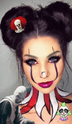 A Woman In A Clown Costume Has A Clown Pin On Her Hair GIF