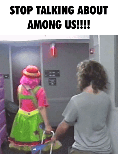 A Woman In A Clown Costume Is Pushing A Man In A Wheelchair With The Caption " Stop Talking About Among Us " GIF