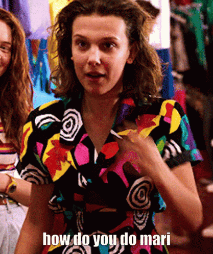 A Woman In A Colorful Shirt Is Asking How Do You Do Mari . GIF