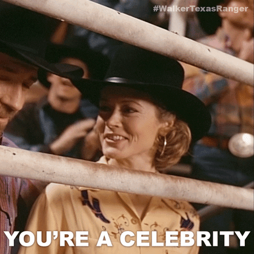 A Woman In A Cowboy Hat Is Behind A Fence And The Caption Says You 'Re A Celebrity GIF