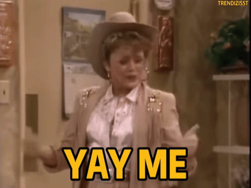 A Woman In A Cowboy Hat Is Dancing And Saying Yay Me GIF
