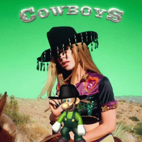 A Woman In A Cowboy Hat Is Riding A Horse Next To A Mario Character GIF
