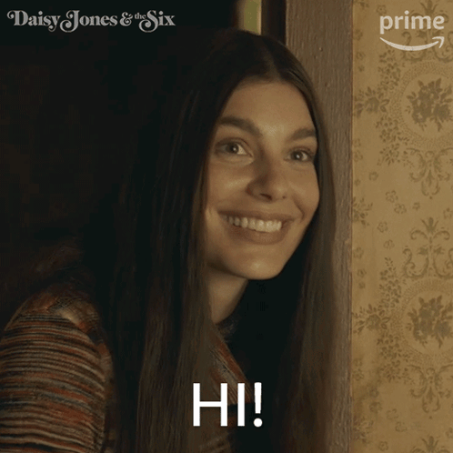 A Woman In A Daisy Jones & The Six Advertisement GIF