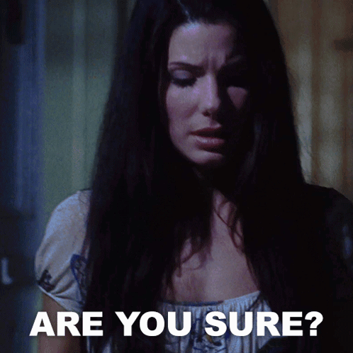 A Woman In A Dark Room With The Words " Are You Sure " Below Her GIF