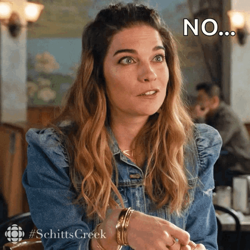 Woman In Denim Jacket Sitting With No Face GIF
