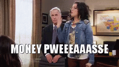 Woman In Denim Jacket Next To Man In Suit GIF
