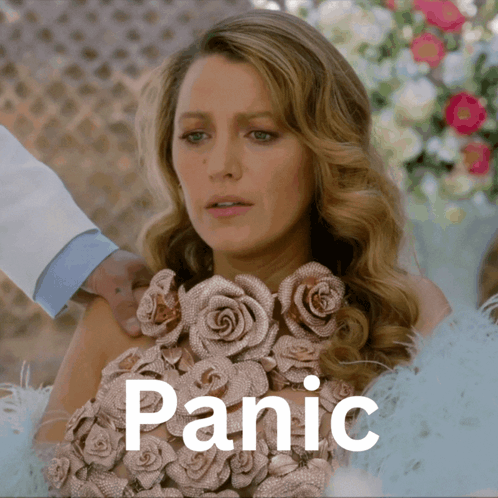 A Woman In A Dress With Roses On It Is Being Held By Someone And The Word Panic Is Above Her GIF