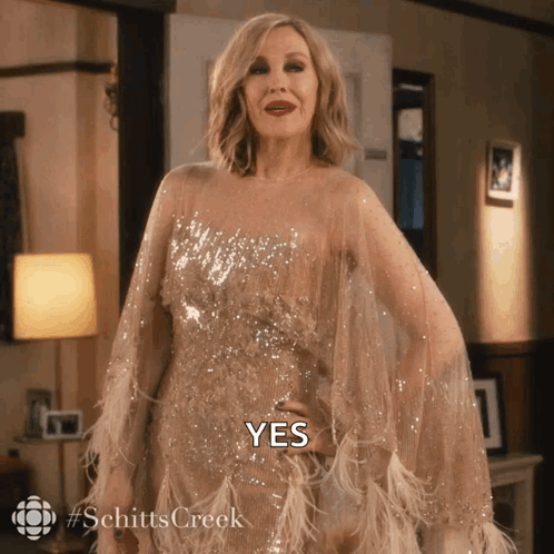 A Woman In A Dress With The Word Yes Written On It GIF