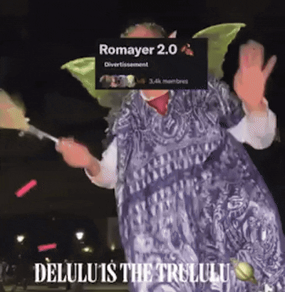 A Woman In A Fairy Costume Is Holding A Fan And Says Romayer 2.0 Delulu Is The Trululu GIF