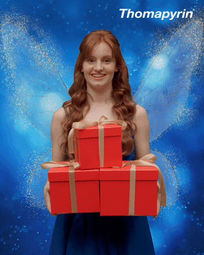 Woman In Fairy Costume Holding Red Thomapyrin Boxes GIF