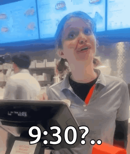 A Woman In A Fast Food Restaurant Behind A Counter Says 9:30 GIF