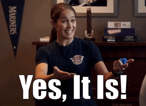 A Woman In A Firefighter Shirt Is Holding A Blue Object And Says Yes It Is GIF