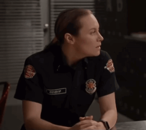 A Woman In A Firefighter Uniform Has The Name T. Bishop On Her Badge GIF