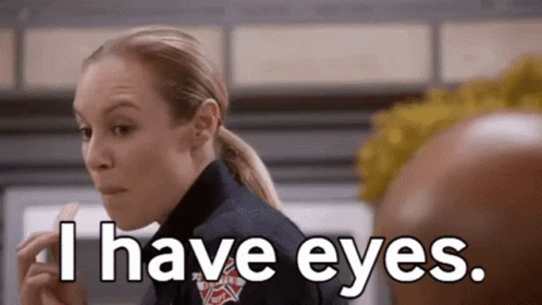 A Woman In A Firefighter Uniform Is Eating A Piece Of Food And Says `` I Have Eyes . '' GIF