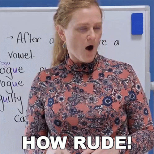 A Woman In A Floral Shirt Says How Rude In Front Of A Whiteboard GIF