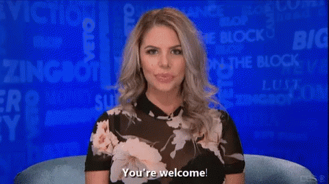 a woman in a floral top is sitting in front of a blue background and says you 're welcome